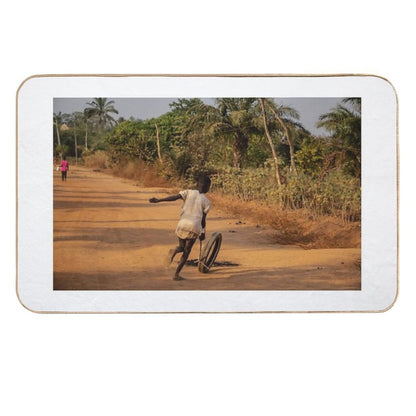Africa Child Playing on The Village Street  Versatile Bath Mat